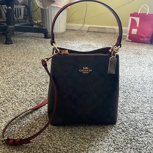 Brand new used once Coach Brown and Red Bucket Bag.